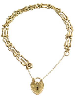 Lot 115 - A 9ct gold three bar gate bracelet, on a heart-...