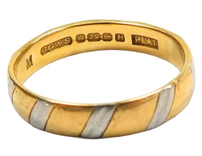 Lot 105 - A 22ct gold and platinum wedding band, size L...