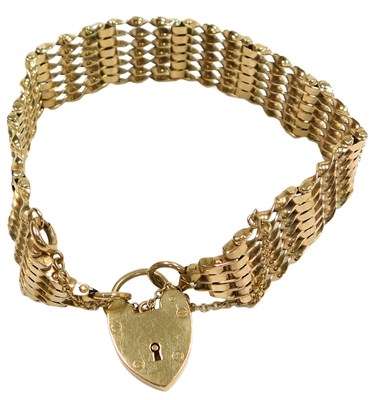 Lot 112 - A 9ct gold seven bar gate bracelet, on a...