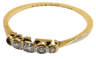Lot 118 - A graduated diamond five stone ring, one...