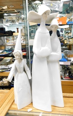 Lot 2299 - Lladro porcelain figures, comprising two nuns...