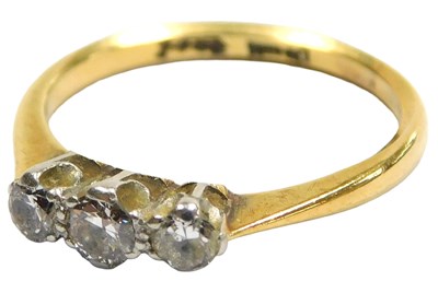 Lot 203 - A diamond three stone ring, in a claw setting,...