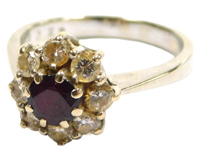 Lot 211 - A ruby and diamond ring, the circular...