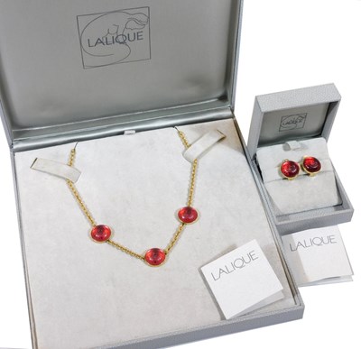 Lot 12 - A Lalique Toupie necklace, with three red...