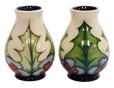 Lot 28 - A pair of Moorcroft pottery Holly pattern...