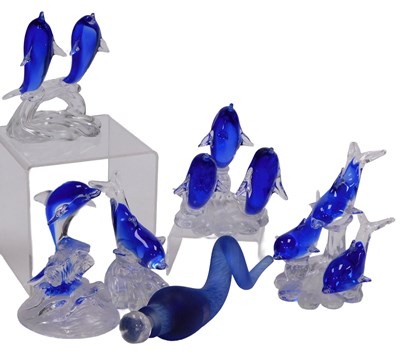 Lot 34 - A group of blue and clear glass dolphin...