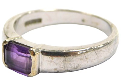 Lot 210 - A 9ct white gold and amethyst solitaire ring,...