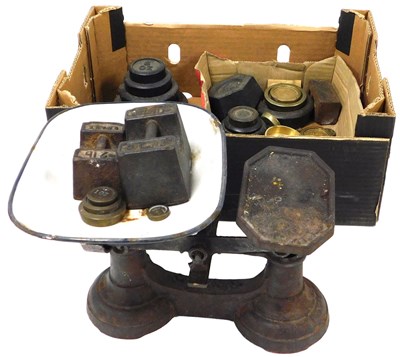 Lot 45 - A set of cast iron kitchen scales, with...