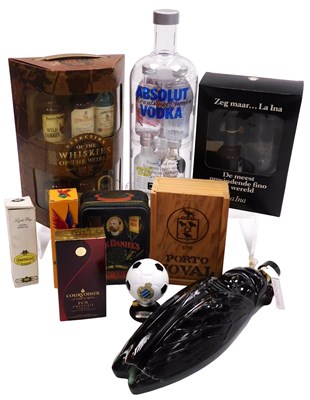 Lot 61 - An Absolut vodka four miniature bottle set,...