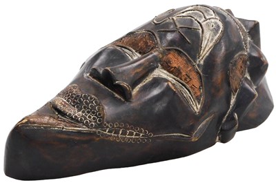Lot 79 - A Cameroon Tikar carved wooden mask, with...