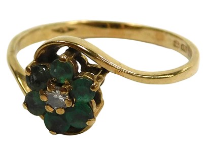 Lot 126 - A 9ct gold emerald and diamond flowerhead ring,...