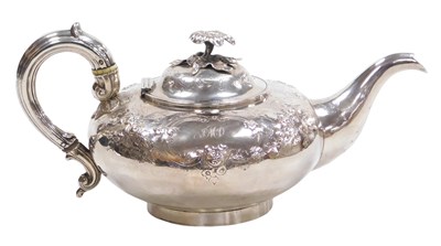 Lot 2 - A Victorian silver melon shaped teapot, with...