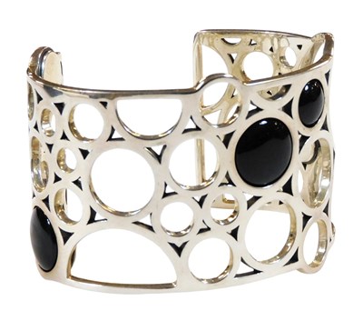 Lot 312 - A Georg Jensen silver and black onyx bangle,...