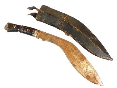 Lot 232 - A 20thC Kukri, with a wooden handle and lion's...
