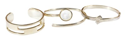 Lot 339 - A silver open work torc bangle, mother of...