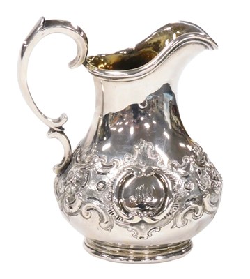 Lot 374 - A Victorian silver cream jug, with embossed...