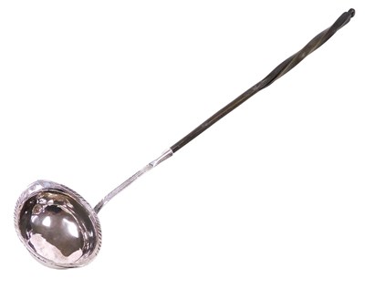 Lot 381 - A Georgian toddy ladle, with engraved foliate...