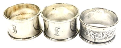 Lot 394 - A pair of George V silver napkin...