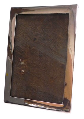 Lot 396 - A George V silver strut photograph frame, of...