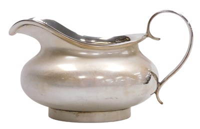 Lot 404 - A George V silver cream jug, of squat form,...