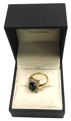 Lot 411 - An 18ct gold demantoid garnet and diamond ring,...