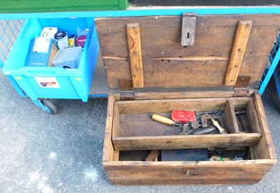 Lot 1135 - A pine tool chest, containing some hand tools...