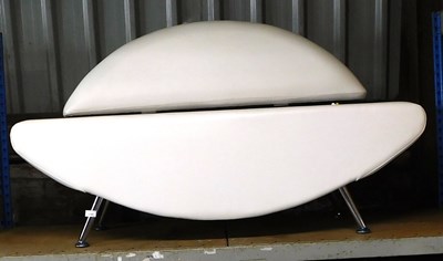 Lot 1157 - A white leatherette upholstered sofa, 130cm wide.