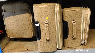 Lot 1158 - A set of three Guess Los Angeles suitcases.