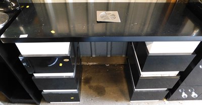 Lot 1183 - A DIR black and white multi drawer twin...