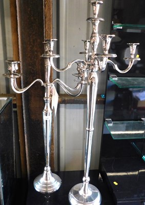 Lot 1185 - Two similar metal four branch candelabrums,...