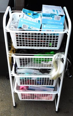 Lot 1189 - A trolley containing four plastic baskets,...