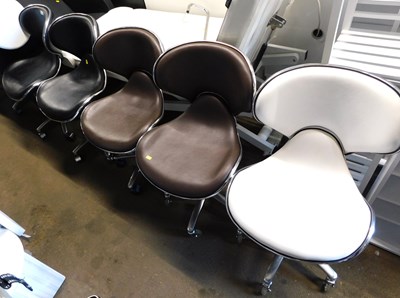 Lot 1202 - Five revolving leatherette chairs, two in...