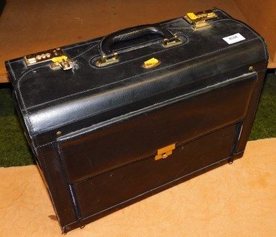 Lot 2032 - A combination black leatherette case.