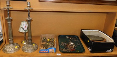 Lot 2066 - A pair of cast metal candlesticks, together...