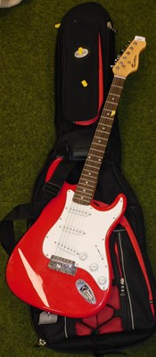 Lot 2069 - A Rockburn electric guitar, in red and white,...