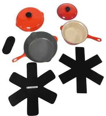 Lot 444 - A Le Creuset red enamel Dutch oven, with a...