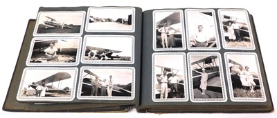 Lot 476 - An early 20thC photograph album, including on...