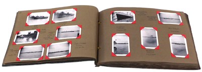 Lot 479 - A mid 20thC album of mercantile photographs,...