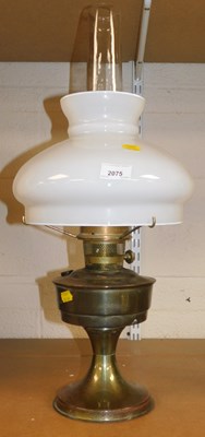 Lot 2075 - A brass oil lamp base, with a milk glass shade...