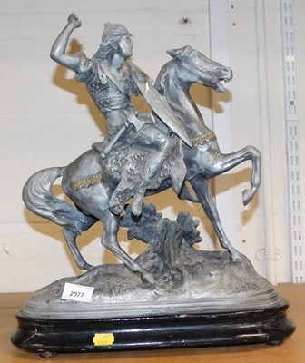 Lot 2077 - A cast metal figure modelled as a figure on...