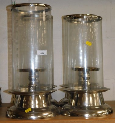 Lot 2084 - A quantity of glass and stainless steel candle...