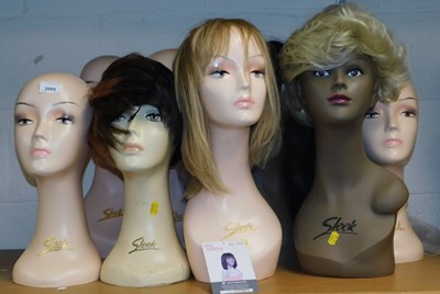 Lot 2089 - A quantity of wig mannequins, some by Sleek,...