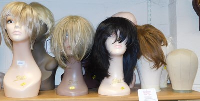 Lot 2090 - A quantity of wig mannequins, some by Sleek,...
