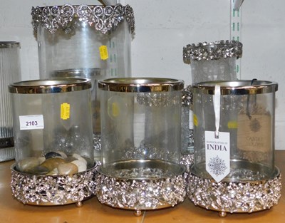 Lot 2103 - A quantity of metal and glass candle holders,...