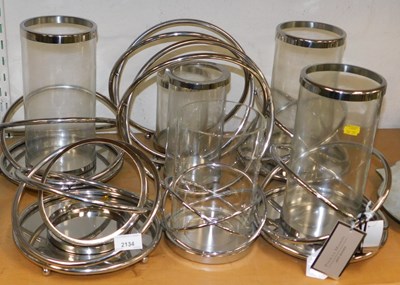 Lot 2134 - A quantity of glass and metal candle holders,...