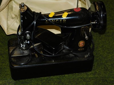 Lot 2147 - A Singer electric sewing machine. Buyer Note:...