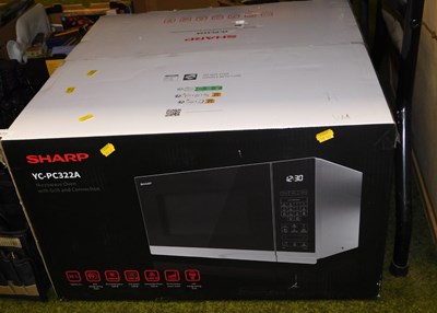 Lot 2177 - A Sharp microwave oven, YC-PC322A, boxed.