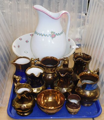 Lot 2193 - A quantity of Victorian copper lustre jugs,...