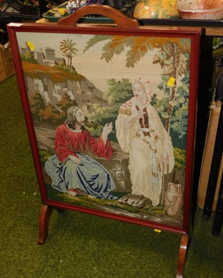 Lot 2211 - A fire screen, inset with a religious tapestry,...