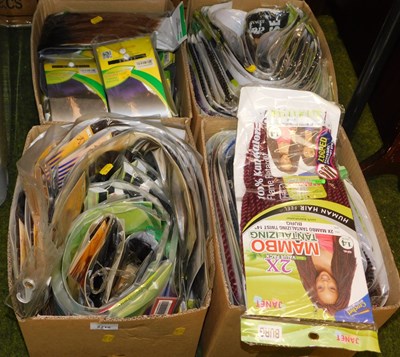 Lot 2212 - A quantity of synthetic hair pieces, braids,...